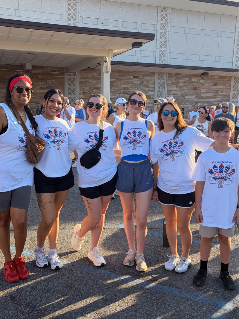 Trey Morris Injury Lawyers team members in their Firecracker 5K race shirts on the morning of the race