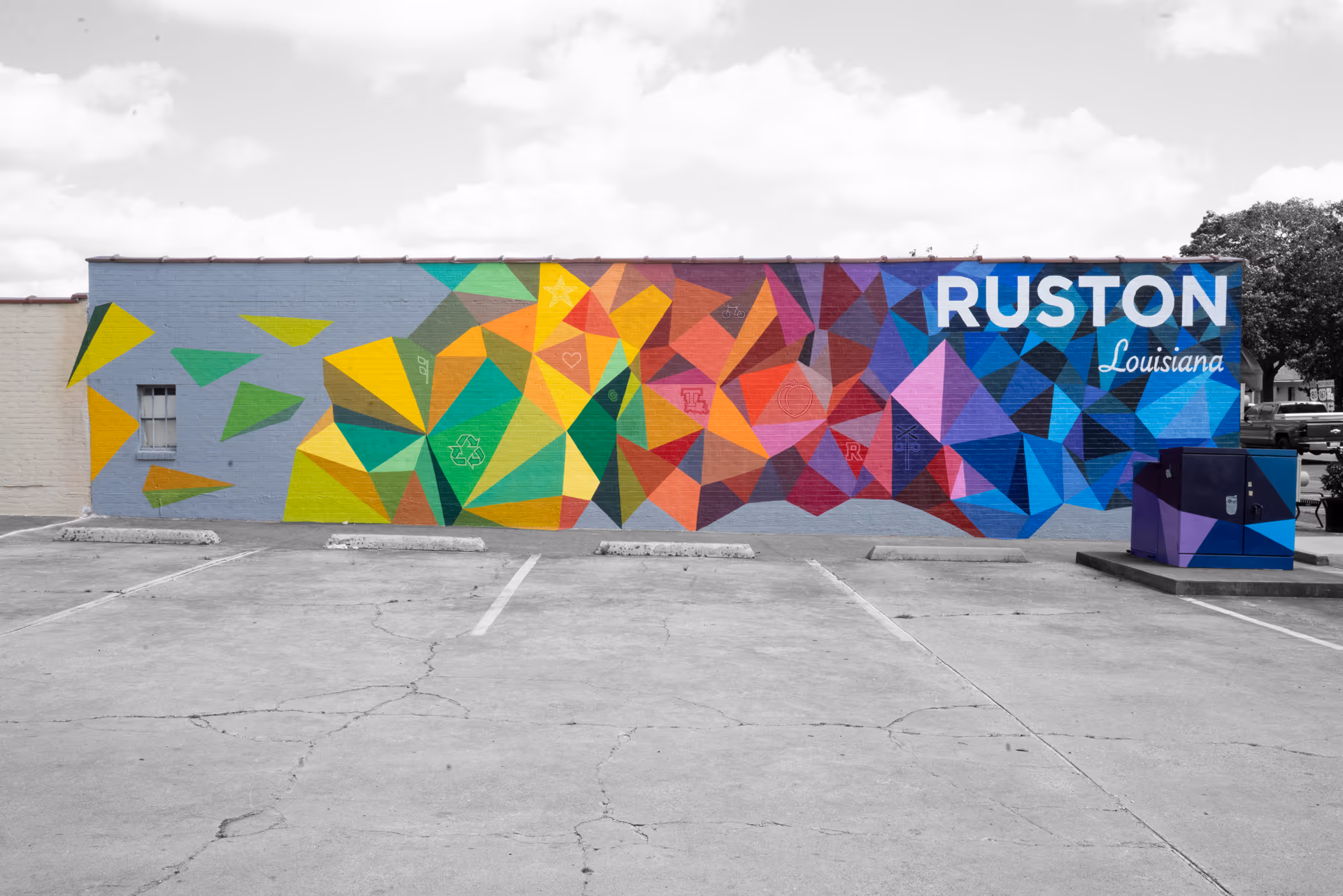 A colorful geometric mural reading Ruston, Louisiana on the side of a building